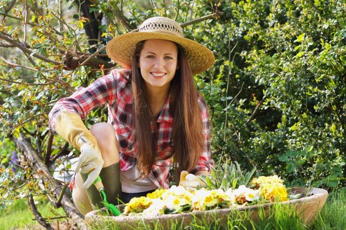Team handling green waste and rubbish during a landscaping job
